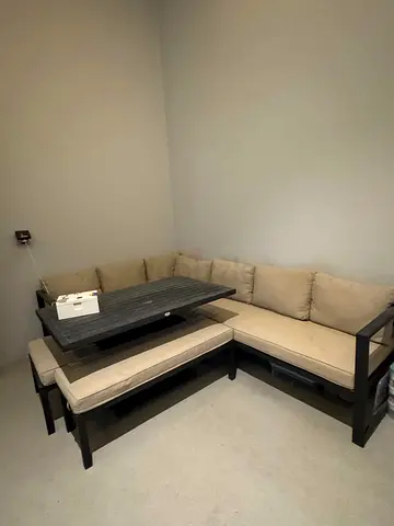 L-shaped wooden frame Outdoor sofa set with cushions and matching coffee table