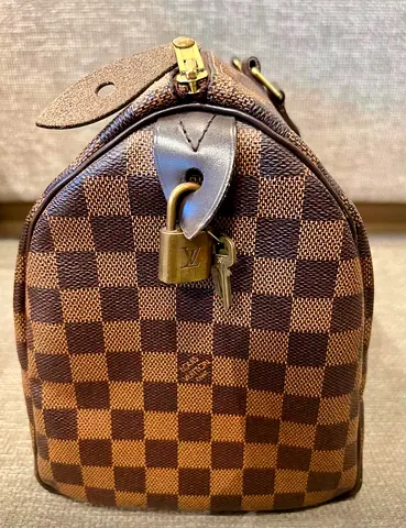 Pre-owned authentic LV bag.