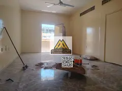 Family Apartment for Annual Rent in Al Nuaimiya 1: Two Master Bedrooms, Spacious Living Room with Ba