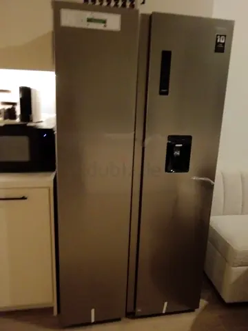 Stainless Steel Side-by-Side Refrigerator and Freezer - Good Condition