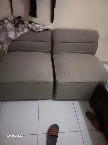 Pair of light grey modular armless chairs — good condition