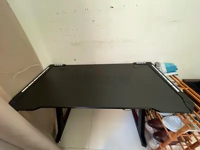 Black gaming/office desk in normal used condition