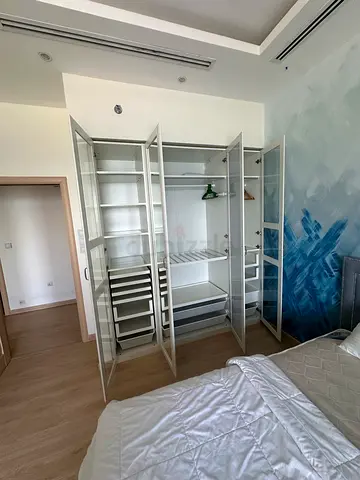 White freestanding wardrobe / armoire with glass doors