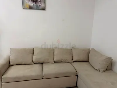 L-shaped beige fabric sofa - 3-seater with chaise (used)