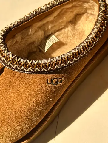 Gently used UGG slip-on suede fur-lined slippers, women’s size (see tag)