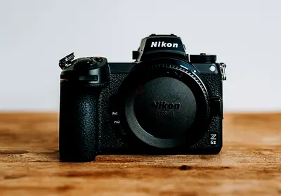 Nikon Z6 II camera and 24 70 lens with 3 batteries 2 battery charging case and 64 gb xqd