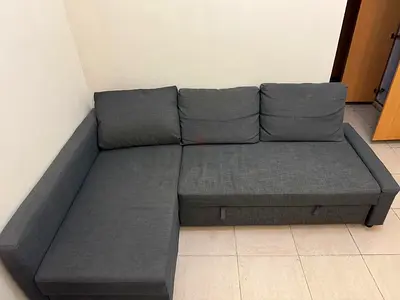 Grey L-shaped IKEA Sofa Bed with Storage - Good Condition