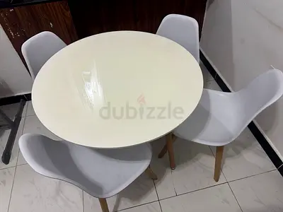 White round dining table with 4 modern chairs - compact set