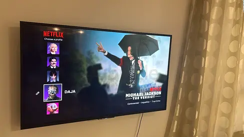 Sony Bravia 55-inch Smart TV mounted on wall - Good condition