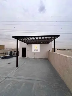 Villa for rent in Al Yasmin consisting of five master bedrooms, a majlis, a living room, a maid'