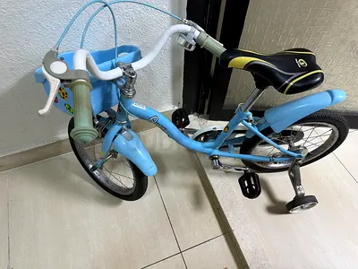 Small kids blue bicycle with training wheels - good condition