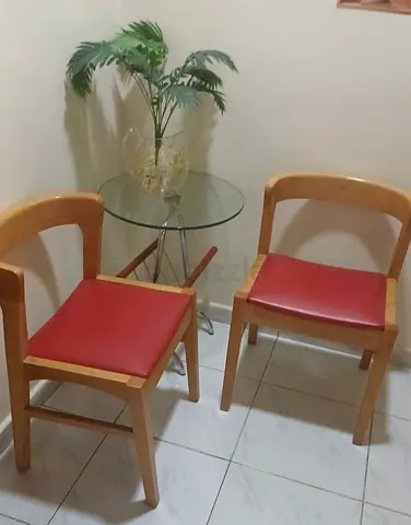 Small Glass Top Table with Two Red Padded Chairs