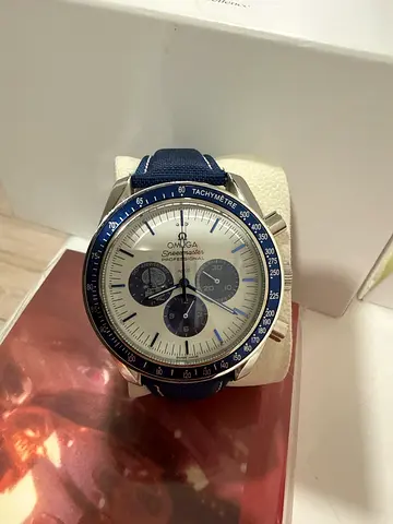 Looks like Omega Snoopy speedmaster style chronograph wristwatch in original box - good condition