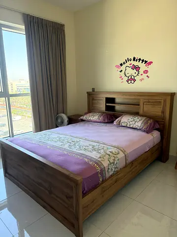 Solid wood double bed with built-in headboard storage - good condition