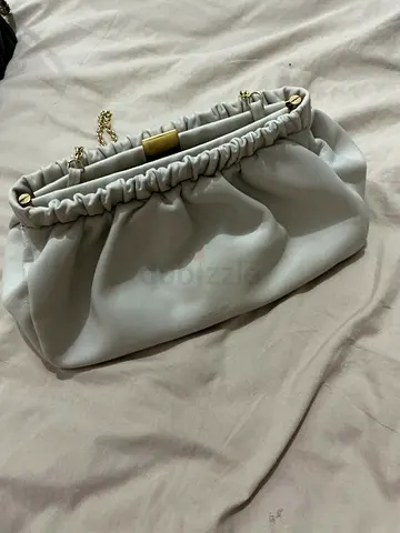 DEMELIER Light grey ruched clutch bag with gold hardware