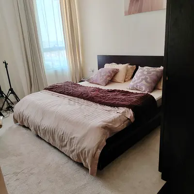 Modern low-profile wooden platform bed with integrated side tables  and Wardrobe