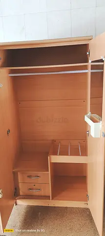 Single-door wooden wardrobe with drawers and hanging rail — good condition