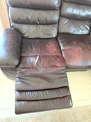 Brown Leather Recliner Sofa with Visible Wear