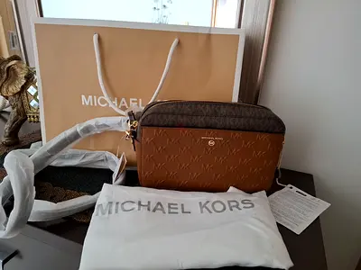 Michael Kors small crossbody bag with dust bag and box, receipt.