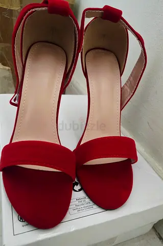 Pair of red suede ankle-strap womens heels, gently used