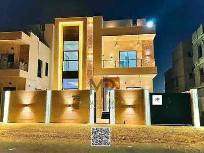 Modern 4-bedroom villa with a roof terrace, including registration fees, in Al Bahia, Ajman. Super deluxe finishing, freehold ownership, bank financin