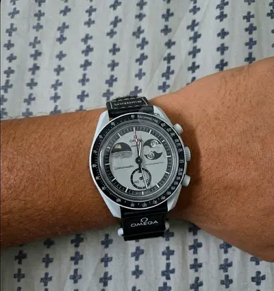 Omega original mission to earthphase watch just 20 days old with everything bill box card