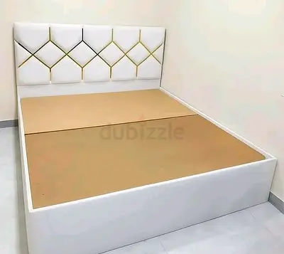 White upholstered double bed frame with padded headboard