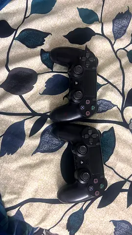two black ps4 dualshock controller and one is 35 both are 70