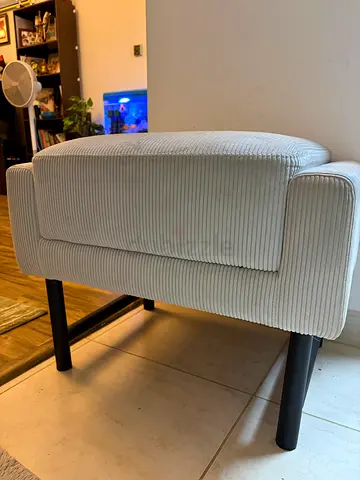 Small upholstered bench/ottoman in light beige corduroy fabric