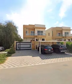 Annual villa for rent in Al Mowaihat 2, featuring 5 master bedrooms and a garden.
