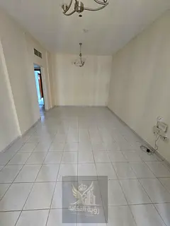 Two rooms and a hall for rent in Al Nahda, a great location directly on the Dubai exit, close to Nes