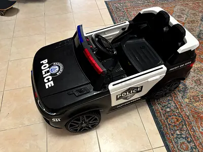 Police Car for Kids (your kid can drive it or you can control it using the included remote control!)
