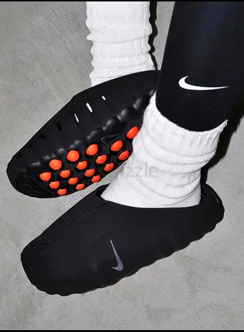 Pre-owned Nike slip-on clogs with orange studded sole, size available