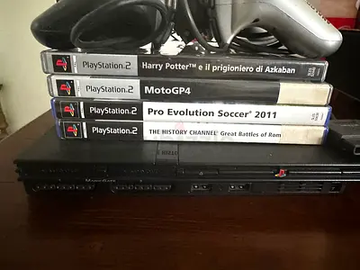 PlayStation 2 Slim with 4 Games and 2 Controllers