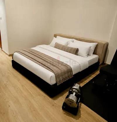 King-sized upholstered bed with medical mattress - almost brand new (guest room never gets used)