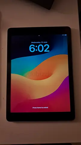 6th Gen iPad with case and charging cable