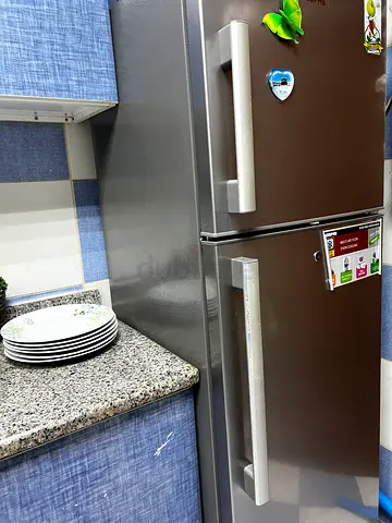 Double-door refrigerator in good working condition