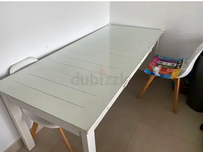 White glass-top dining table with wooden legs (seats 4) - good condition