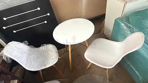 Small white dining/bistro set — 2 chairs + round table, minimal wooden legs