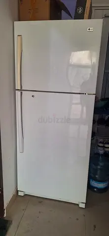LG 2 door fridge,front load washing machine queen cot with new med mattress  wooden wardrobe LPG