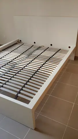 White queen bed frame with slatted base and headboard