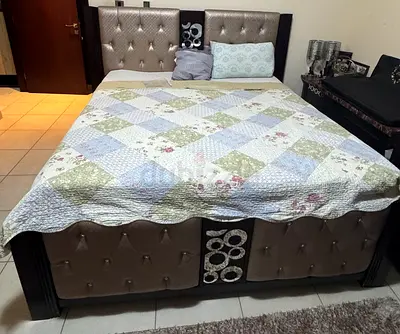 Queen size upholstered bed frame with padded headboard and footboard