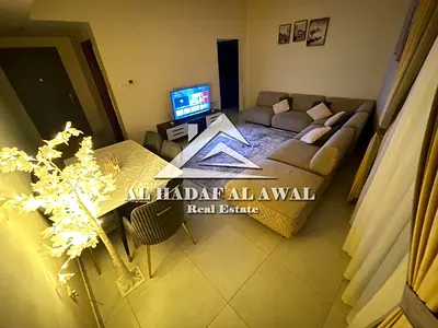 Two-bedroom apartment with a living room for monthly rent in Al Taawun area with free internet.