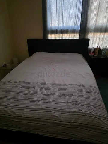King bed with upholstered headboard in good condition