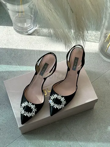 SJP black heels