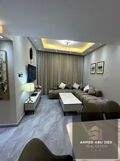 Two bedrooms, large living room, spacious kitchen, multiple bathrooms, central air conditioning, fle