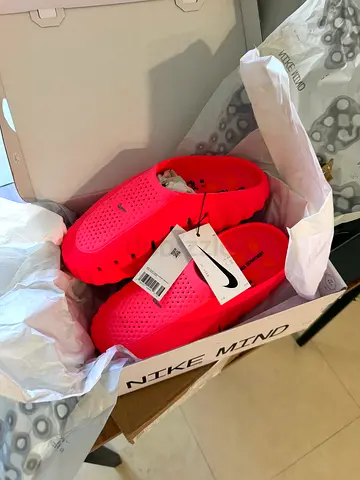 Brand new Nike pink slip-on casual shoes, size tagged