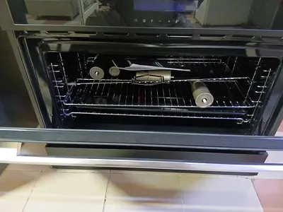 Omega 90cm Freestanding Cooker (Model OFOIC909B) featuring a sleek black glass induction cooktop.