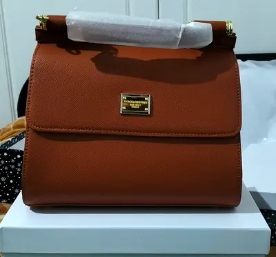 Brown structured leather handbag with top handle - like new