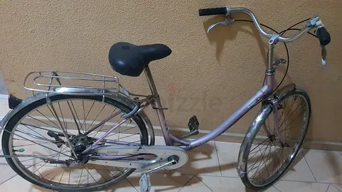 Classic step-through pink bike — reliable daily commuter